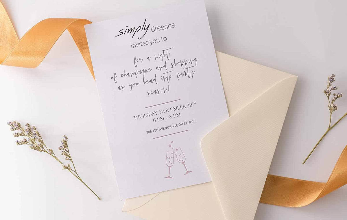 Close up of a Simply Dresses cocktail party invitation.